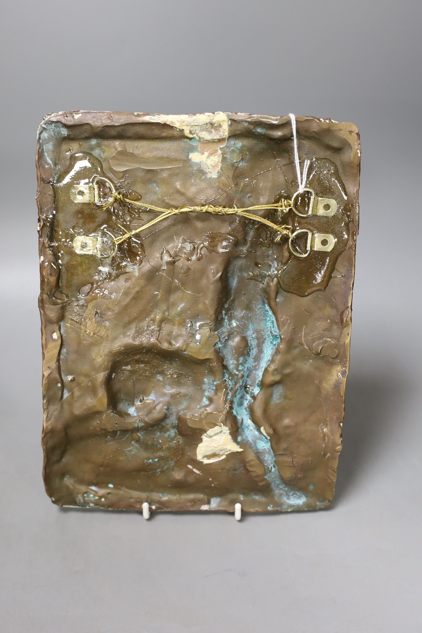 A bronze abstract wall panel depicting a female amongst a lion, 24.5 x 18.5cm, together with a vessel in the form of a toad (2)